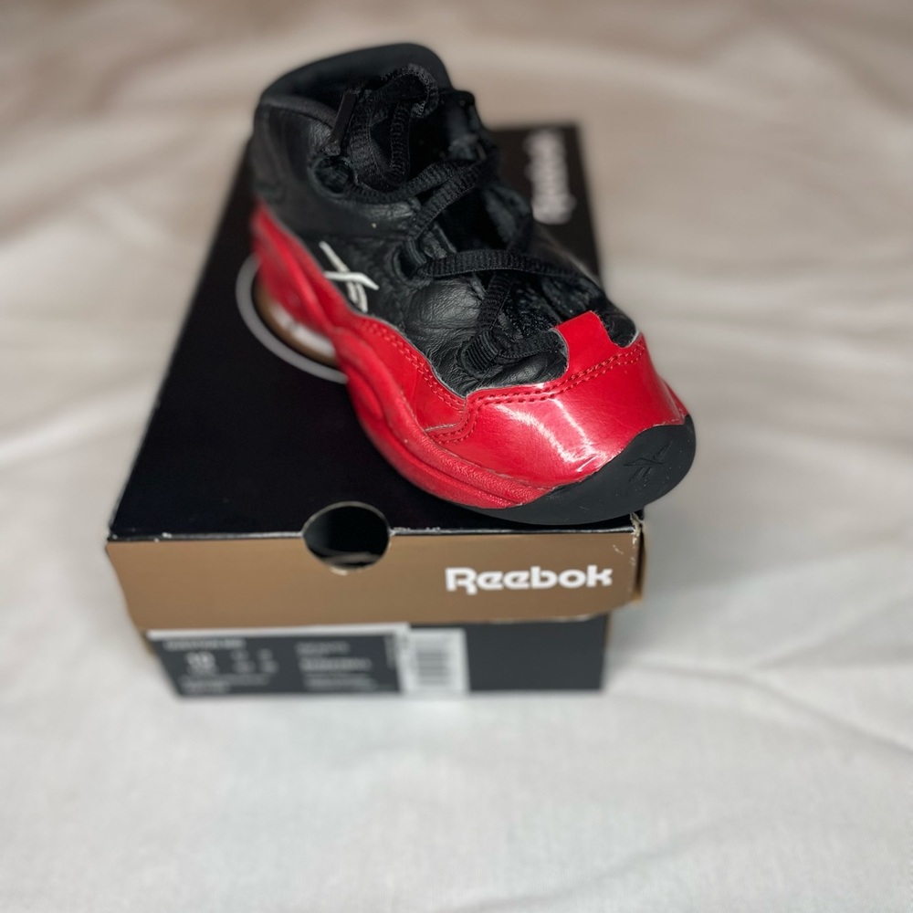 Black and red Reebok question mids